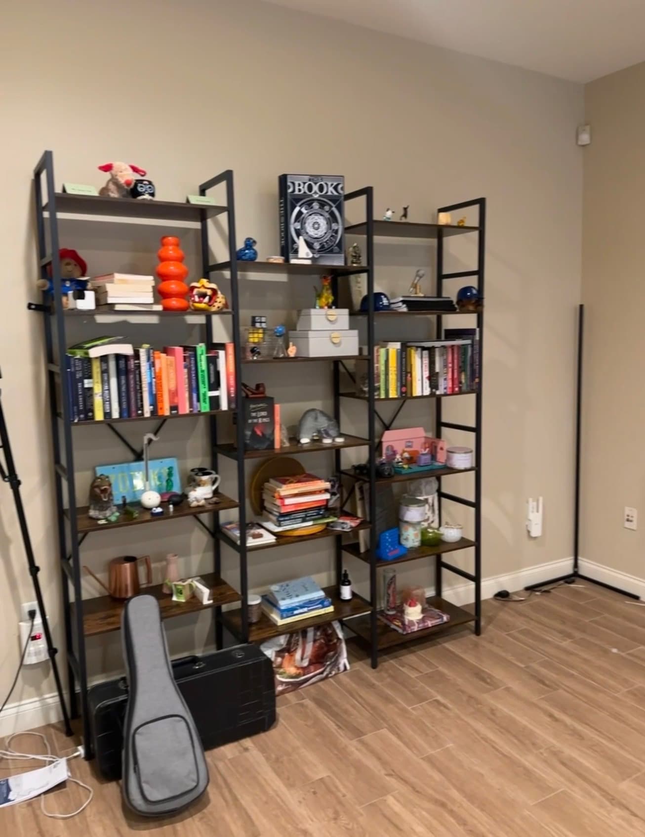 Books and personal objects arranged on open shelving